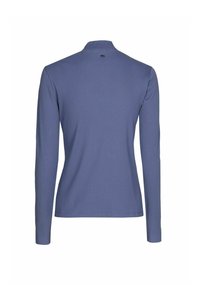 Haut à manches longues côtelé de couleur bleu clair avec un col montant. Il présente un petit logo dans le dos et une coupe ajustée pour un look sur mesure.