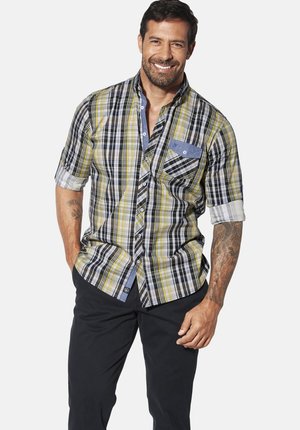 Short-sleeve plaid shirt in yellow, black, and white. Features a denim pocket and button-down closure. Smooth fabric with a relaxed fit.