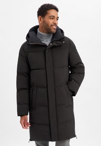 Schwarzer Steppmantel mit Kapuze, mit gestepptem Design, Frontreißverschluss und zwei seitlichen Reißverschlusstaschen. Weiche Textur, knielange Passform.