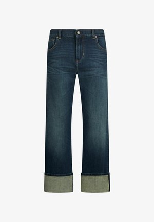 Dunkelblaue Jeans aus Denim mit geradem Bein, ausgestattet mit einem umgeschlagenen Saum aus kontrastierendem grünem Stoff. Knopfverschluss mit klassischen Taschen.