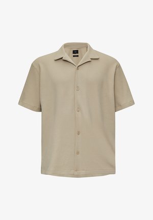Chemise beige à manches courtes avec un motif check texturé, fermeture à boutons et col. Fabriquée en tissu respirant.