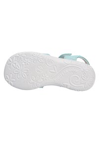 Soletta in gomma bianca con motivo floreale e accenti curvi. Parte superiore azzurro chiaro con finitura glitterata. Cinturino regolabile in velcro.