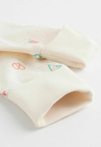 Heller Creme Baumwollstoff mit bunten verspielten Mustern, darunter Dreiecke und Brezeln. Die Bündchen haben ein umgeschlagenes Design. Glatte Textur.