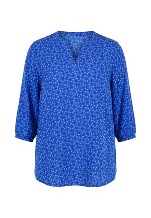 Blaue Bluse mit kleinen weißen Herzmustern, dreiviertel Ärmeln mit elastischen Bündchen und V-Ausschnitt.