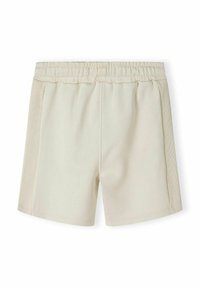 Shorts de sport beiges avec une taille élastique, texture lisse et panneaux latéraux avec un design en relief. Longueur de short standard.