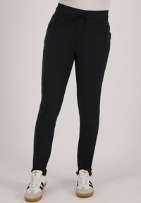 Zwarte joggingsbroek met een trekkoord in de taille, twee zijzakken, slim fit ontwerp, een soepele textuur en een enkel-lange snit.