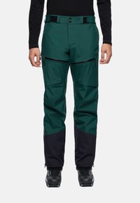 Groene en zwarte waterdichte skibroek met een textuurstof, ritszakken en een verstelbare tailleband. Versterkte onderbenen voor duurzaamheid.