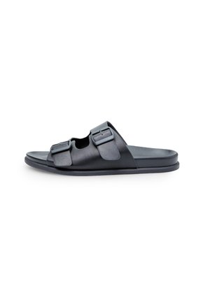 Black leather slide sandal with two adjustable buckles, a flat sole, and an open design. Smooth texture with minimal detailing.