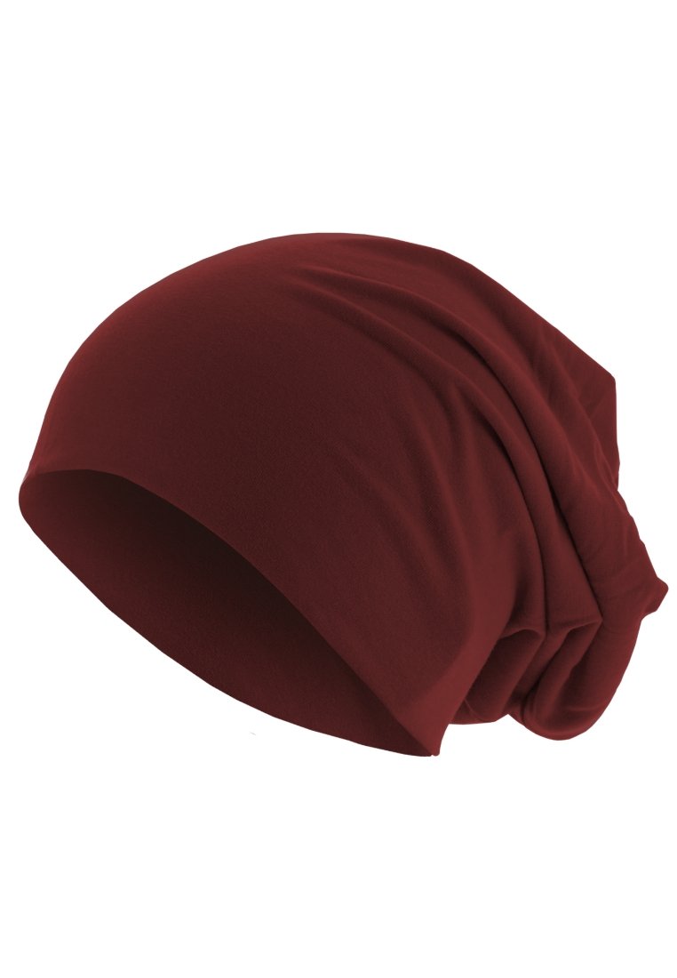 Căciulă roșie, cu un aspect lejer, realizată dintr-un material moale, având o textură netedă, o potrivire largă și un design strâns în partea din spate pentru un plus de volum.