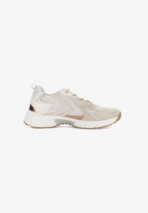 Beige and white mesh athletic sneaker with suede overlays, lace-up front, thick white sole, and a small metallic accent on the heel.