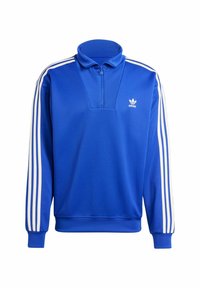 Blaues Polyester-Sweatshirt mit hohem Kragen, halbem Reißverschluss und weißen drei Streifen-Akzenten an den Ärmeln. Verfügt über ein kleines Logo auf der Brust.