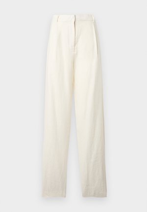 Aukštos juosmens kreminės spalvos lininės kelnės su plačiomis kojomis ir paslėpta priekinio užsegimo detale, pateiktos šviesiame fone.