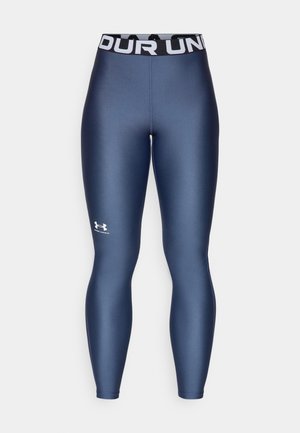 Leggings ajustés bleu marine avec une texture lisse, taille élastique arborant le texte "UNDER ARMOUR" en blanc et un logo sur la jambe inférieure.