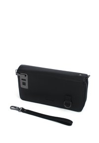 Black leather clutch bag with a textured finish, featuring a metal clasp and a detachable strap. Zip closure and branding on the front.