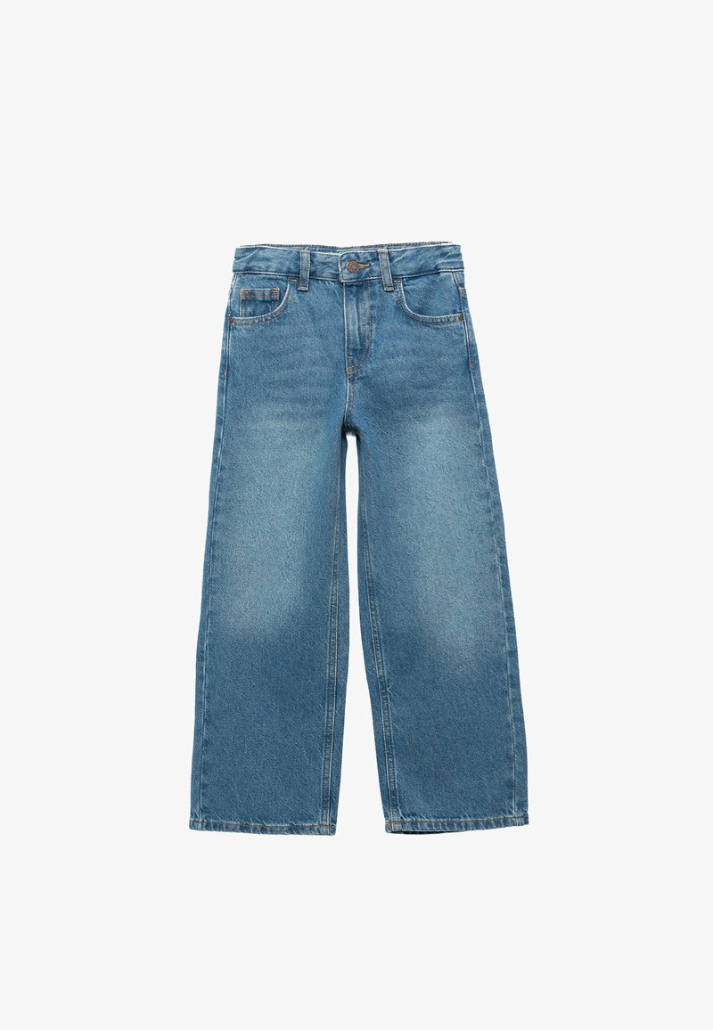 Vaaleansiniset farkkulegginsit, joissa on korkea vyötärö, viisi taskua ja hillitty haalistunut rakenne. Viimeistelty sävyttämällä ompelulla ja metallinappilla.