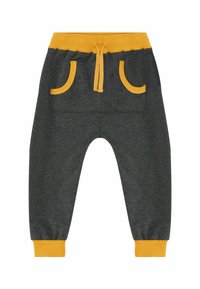 Grijze joggerbroeken met een gele tailleband en zakaccenten. Beschikt over een elastische trekkoord, geribbelde boorden en een zachte textuur.