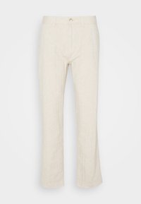 Linnebyxor i ljusbeige, rak bendesign, framknäppning, subtil textur, med standardfickor och skräddarsydda sömmar.