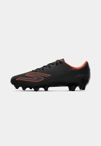 Black soccer cleat with textured upper, orange accents, and black molded studs. Features laces and a streamlined design for performance.