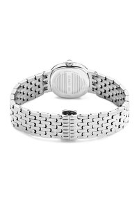 Silver stainless steel watch with a mesh bracelet and a round case. Features a textured back with engraved brand name and details.