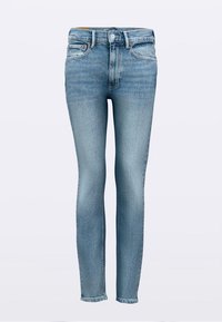 Hele sinine teksariidest kitsad püksid klassikalise viie tasku disaini, nööpkinnituse ja õrnade tuhmumistega reitel ja põlvedel.