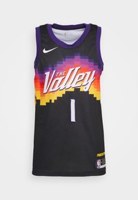 Svart baskettröja med meshstruktur, prydd med lila detaljer, pixelgrafik i orange/gult, texten "The Valley" och spelarens nummer 1.