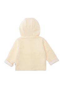 Soft, cream-colored fleece jacket with a hood, rolled cuffs, and a simple design, featuring no visible fasteners or patterns.
