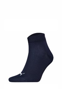 Marineblaue, niedrig geschnittene Socken aus glattem Stoff mit geripptem Bündchen, ausgestattet mit einem weißen Logo-Detail und einer konturierten Form für eine enge Passform.