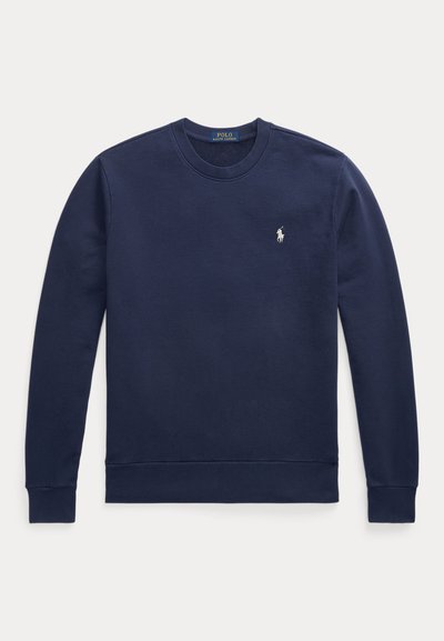 Mørkeblå sweatshirt laget av myk stoff, med rund hals, ribbestrikkede mansjetter og en liten hvit broderte logo på brystet.