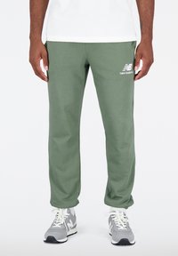 ESSENTIALS STACKED LOGO  - Tracksuit bottoms - deep olive green
