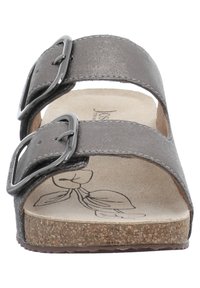 Gray faux leather sandal with two adjustable straps, metal buckles, a cork footbed, and a textured insole featuring a leaf design.