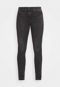 Jeans skinny de mezclilla negra con una cintura alta, que presentan un cierre de botón, lazos para cinturón y un ligero desvanecimiento, diseñados para una silueta ajustada.