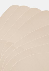 Beige fabric swatches stacked, featuring a textured surface and subtle stitching along the edges, arranged in a fan-like display.