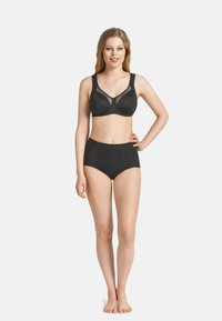 Black lingerie set featuring a bra with a sheer panel and adjustable straps, paired with high-waisted briefs. Smooth fabric texture.