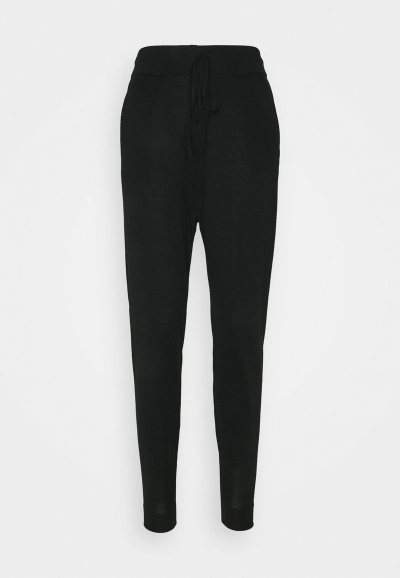 Zwarte joggerbroek van lichtgewicht stof, met een elastische tailleband en drawstring, taps toelopende pijpen en zonder zichtbare patronen of accenten.