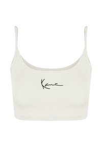 Biely skrátený top s tenkými ramienkami, zdobený čiernym vyšitým logom. Mäkko materiál s hladkou textúrou a minimalistickým dizajnom.