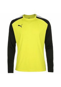 Langärmliges Sportshirt mit einem leuchtend gelben Körper, schwarzen Ärmeln und einem schwarzen Logo auf der Brust. Hergestellt aus leichtem, atmungsaktivem Material.