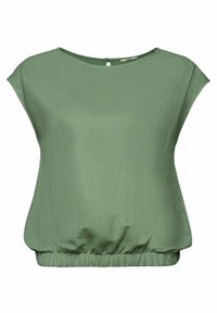 Blouse verte à manches courtes avec encolure ronde, fermeture par bouton avec ouverture en forme de goutte d'eau au dos, et ourlet élastiqué.