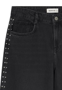 Black denim jeans with silver stud detailing along the side seam, front pocket, belt loops, and a branded button closure.