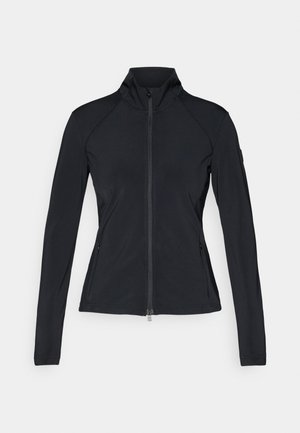 Must mustriga jakki, millel on kõrge kaelus, pikad varrukad ja küljetaskud. Valmistatud siledast ja venivast materjalist, millel on raglandi õmblused.