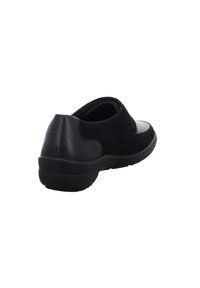 Black footwear featuring a combination of smooth and suede textures, rounded shape, low profile, and rubber sole. No laces or visible hardware.