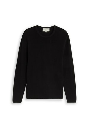 Schwarzer Pullover mit langen Ärmeln und Rundhalsausschnitt aus strukturiertem Stoff mit einem kleinen Etikett im Kragen.