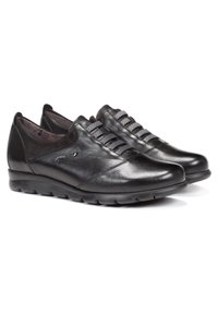 Scarpe in pelle nera con una finitura liscia, lacci elastici e punta arrotondata. Presentano una suola imbottita per comfort e durata.
