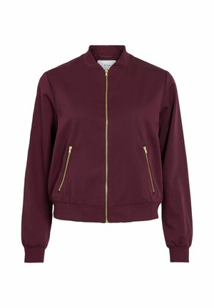 Veste bombers bordeaux avec fermeture éclair dorée et deux poches avant zippées, poignets et ourlet côtelés, et un petit col montant.