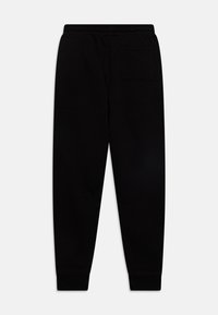 Svarta sweatpants med avslappnad passform, elastisk midja och en enda bakficka. Tillverkade av mjukt, slitstarkt tyg med en jämn yta.