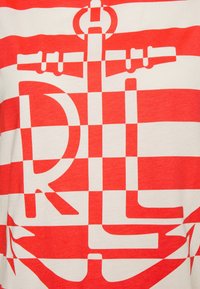 Red and white horizontal stripes with a large anchor and the letters "R" and "L" integrated into the design.