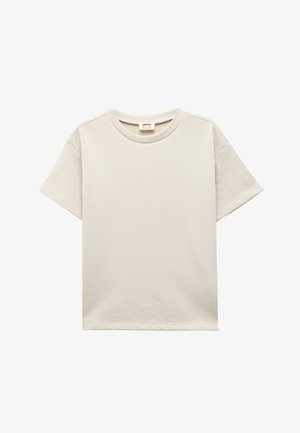 Hellbeige T-Shirt mit kurzen Ärmeln und rundem Ausschnitt, weicher Textur und minimalistischem Design. Ideal für legere Anlässe.