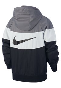 Mikina s kapucí Nike s barevným blokem v šedé, bílé a černé barvě, lesklým černým logem a elastickými manžetami a lemem.