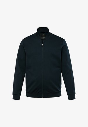 Laikinas žieminis džemperis, pagamintas iš minkštos medžiagos, turi stovinčią apykaklę, ilgomis rankovėmis, šonines kišenes, ir gumbinėmis rankovėmis bei apačia.