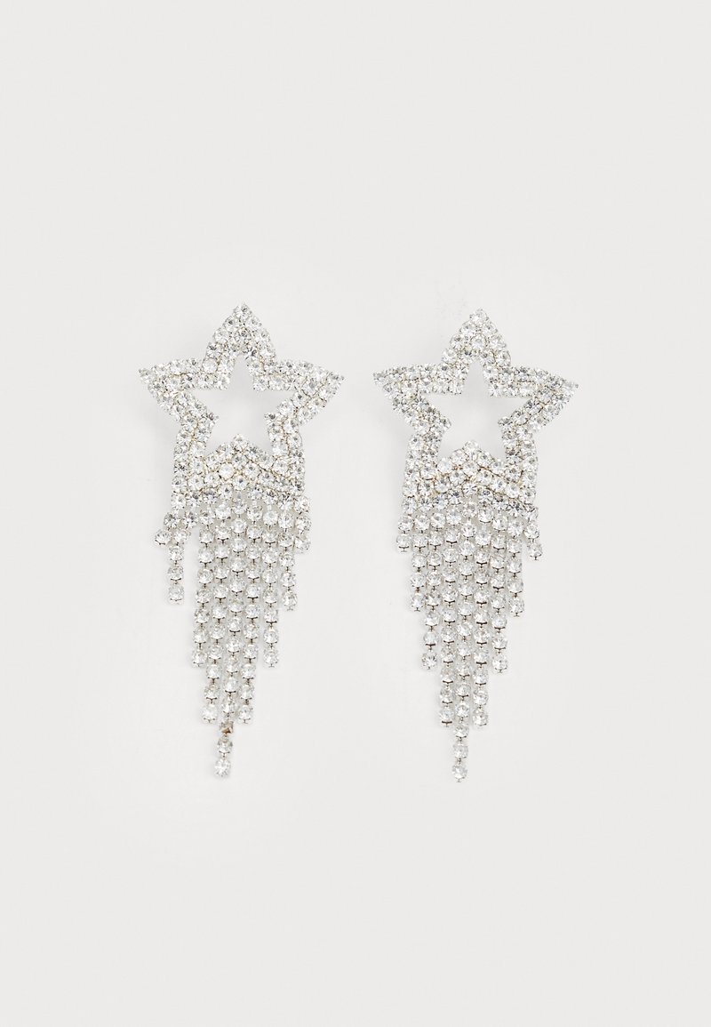 Rhinestone ster oorbellen met waterval franje, in een zilverkleurige tint en een glanzend, reflecterend oppervlak. Stervorm met ingewikkeld ontwerp.