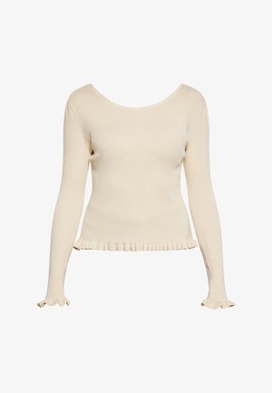 Bež ribani dugi rukav majica s okruglim izrezom i volanima na rubu. Ima uske rukave s izbačenim krajevima i strukturiranu tkaninu.